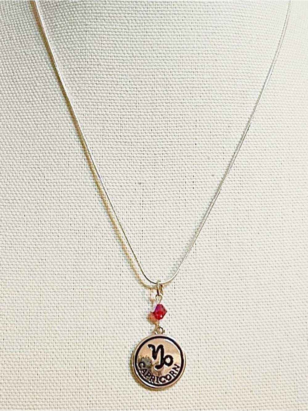 Capricorn Zodiac Pendant Necklace with Red Crystal